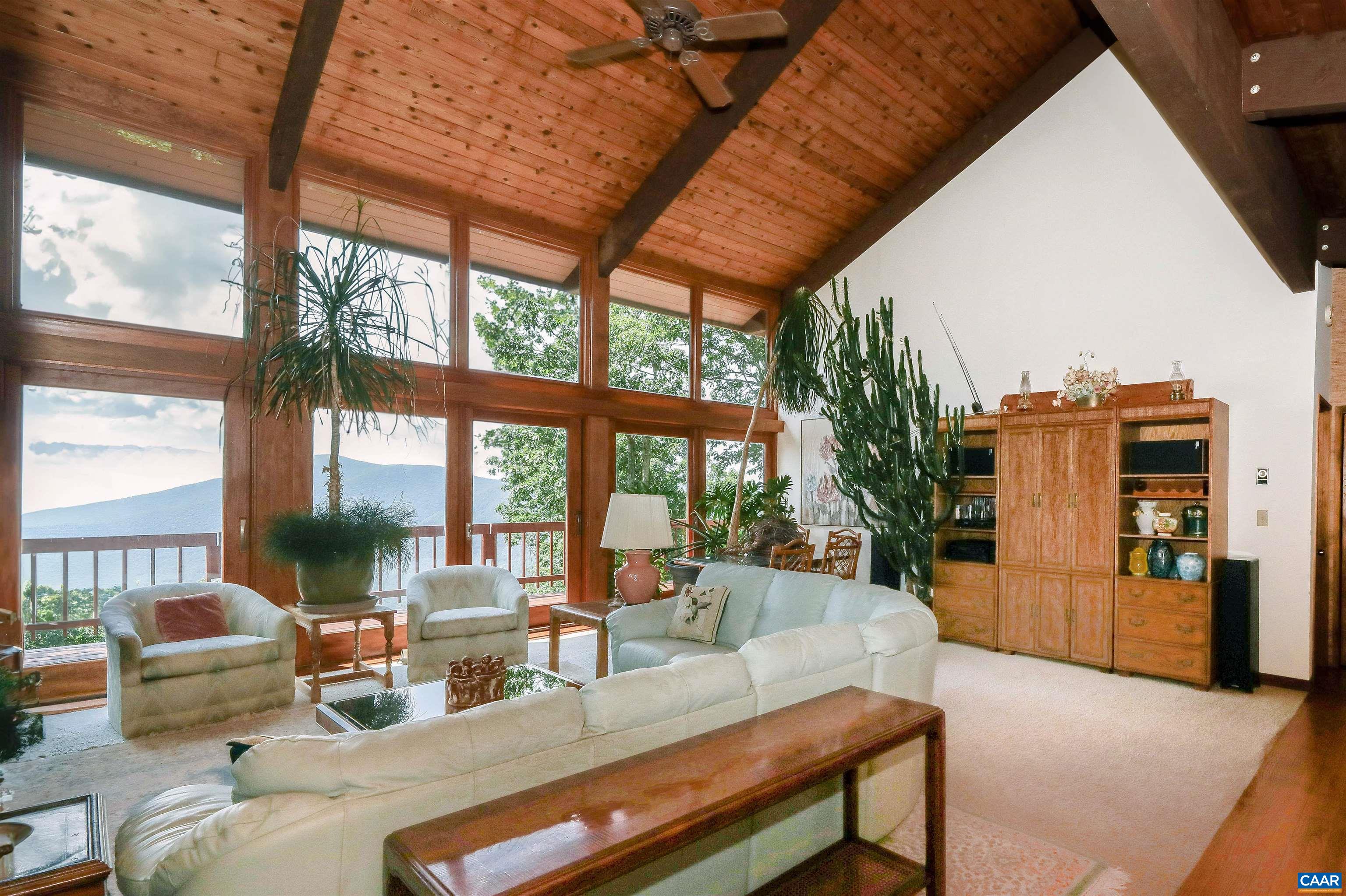 383 Cedar Drive Wintergreen, VA 22967 - Photo 10 of 47 a living room with furniture and large windows
