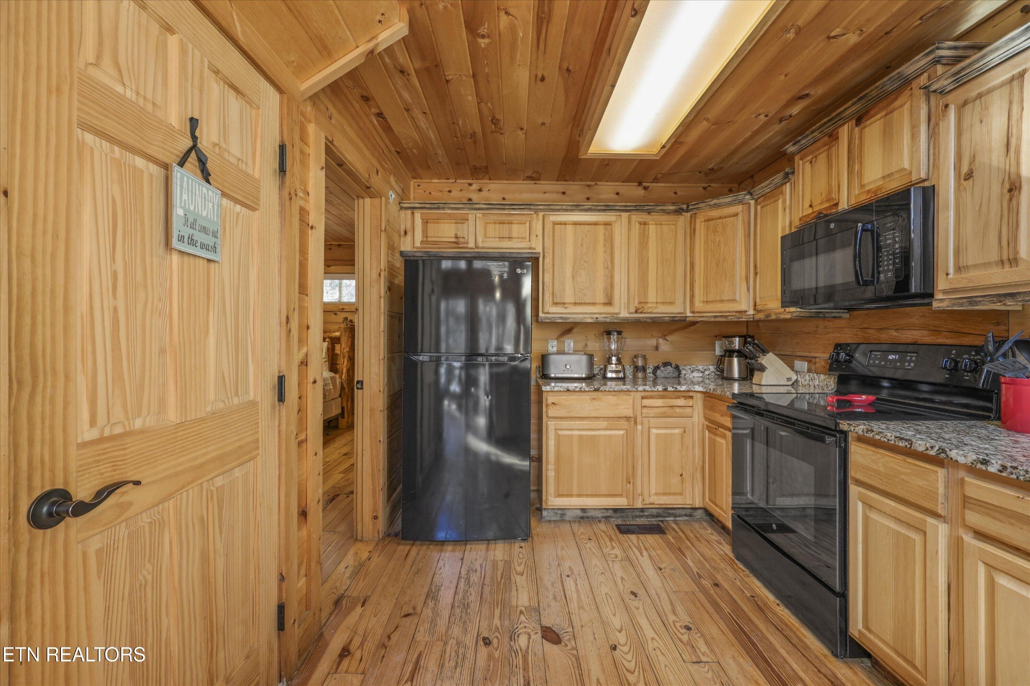 253 Cartertown Road Gatlinburg, TN 37738 - Photo 13 of 30 a kitchen with a refrigerator a stove top oven a sink and dishwasher