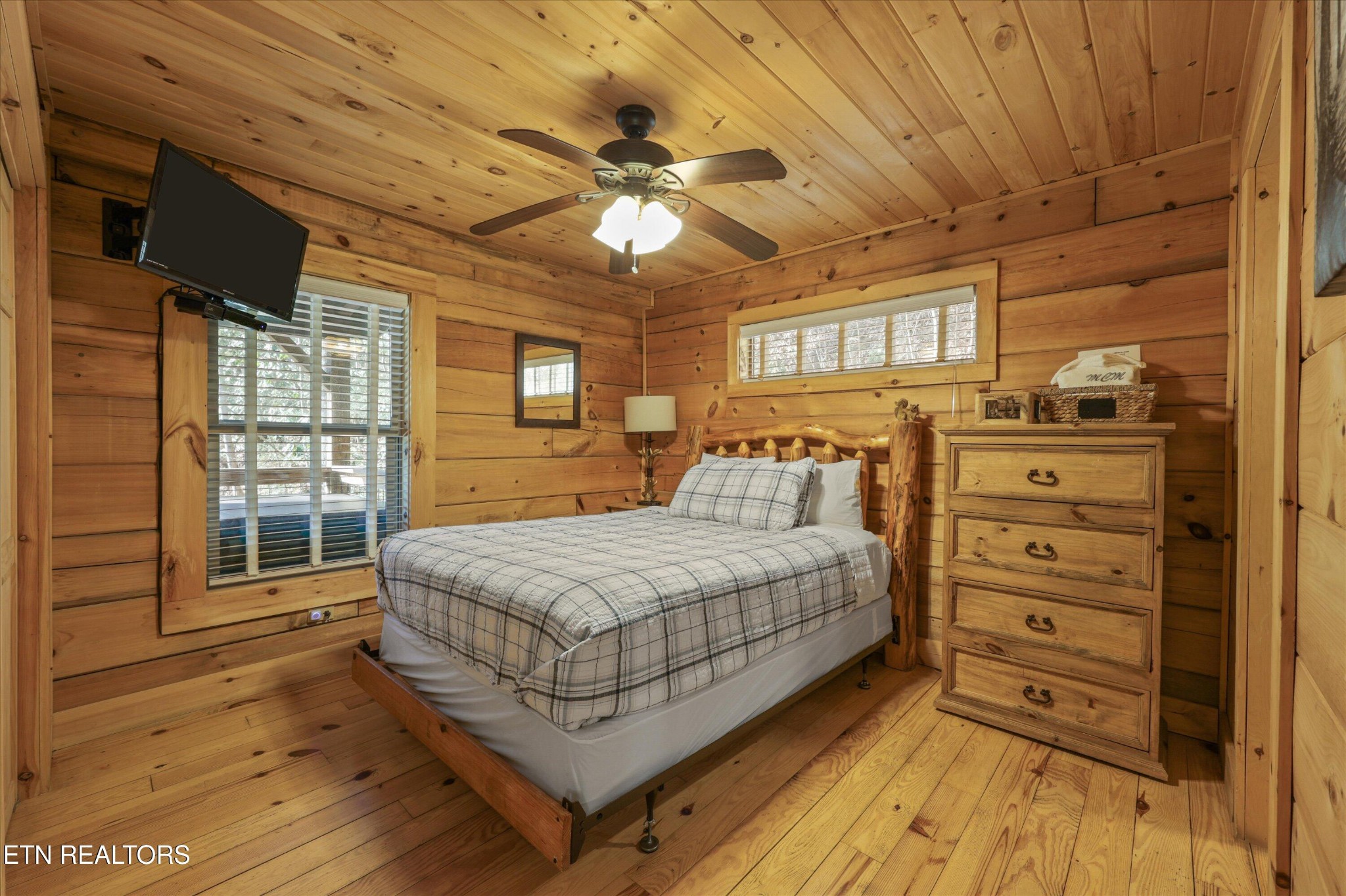 253 Cartertown Road Gatlinburg, TN 37738 - Photo 16 of 30 a bedroom with a bed and a large window