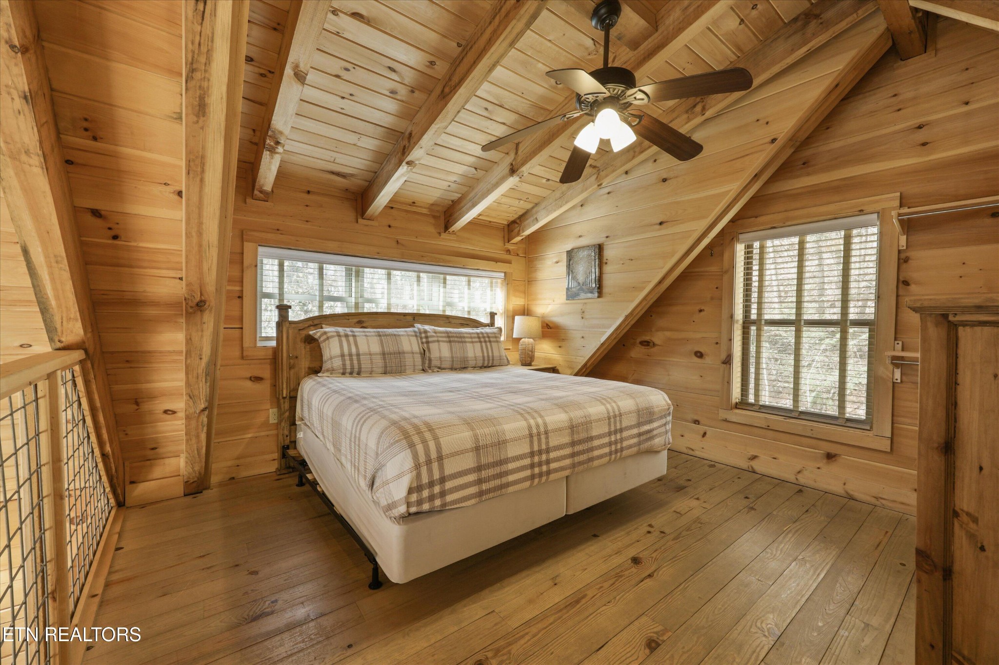 253 Cartertown Road Gatlinburg, TN 37738 - Photo 19 of 30 a bedroom with a bed closet and flat screen tv