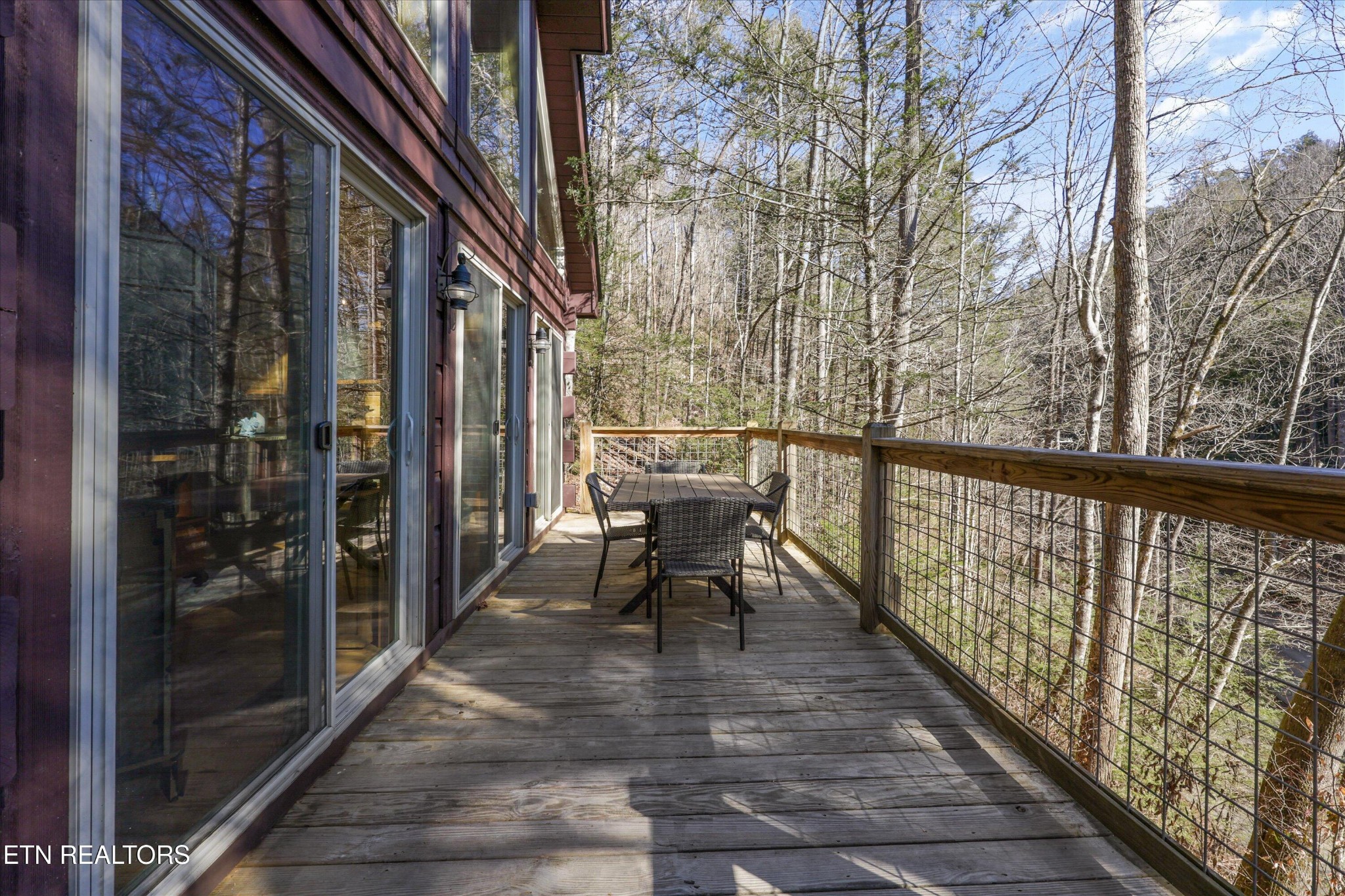 253 Cartertown Road Gatlinburg, TN 37738 - Photo 24 of 30 a view of a balcony with chairs and wooden fence