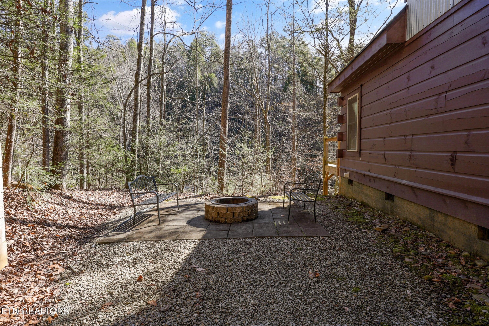 253 Cartertown Road Gatlinburg, TN 37738 - Photo 26 of 30 a view of a backyard with plants and outdoor seating