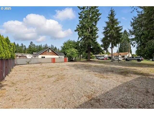 a view of road with large trees