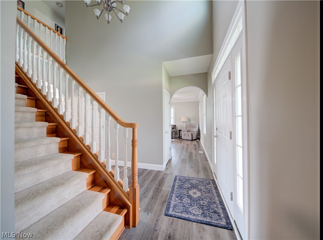 9900 Mentor Road Chardon, OH 44024 - Photo 18 of 49 Entryway with a chandelier and light wood-type flooring