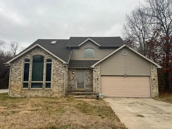 a house with trees in the background