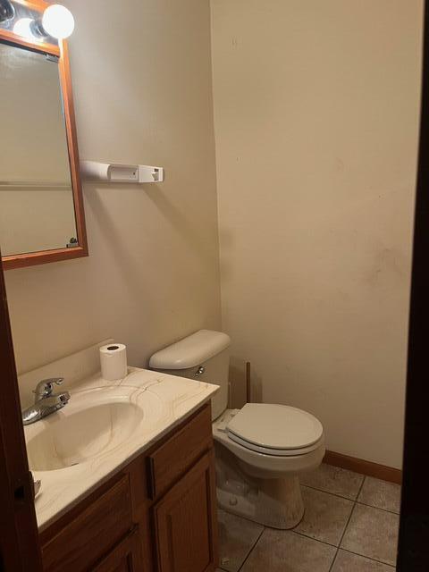 3836 West 25th Avenue Gary, IN 46404 - Photo 11 of 41 a bathroom with a sink a toilet and mirror