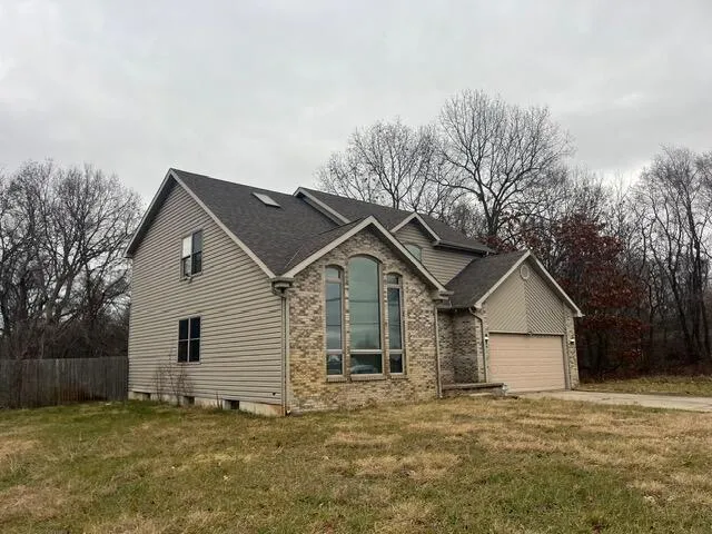 a view of a backyard with a small cabin