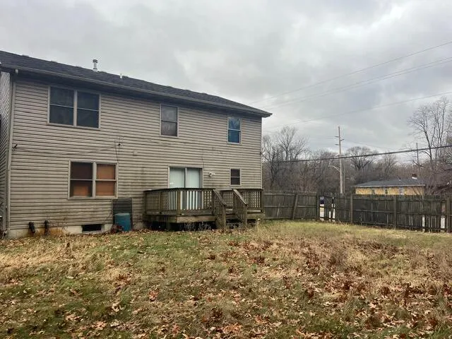 a kitchen with stainless steel appliances granite countertop a refrigerator stove top oven a sink and dishwasher