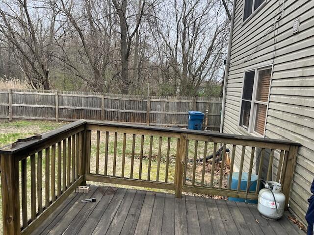 3836 West 25th Avenue Gary, IN 46404 - Photo 7 of 41 a view of a balcony with wooden floor and fence