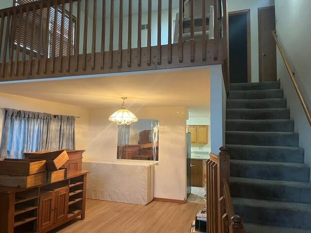 3836 West 25th Avenue Gary, IN 46404 - Photo 10 of 41 a view of a living room with furniture and stairs