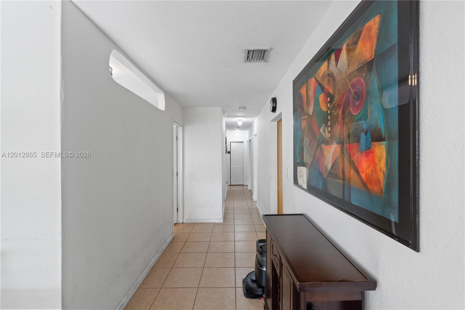 5300 Northwest 30th Place Miami, FL 33142 - Photo 14 of 35 a view of a hallway with furniture and floor to ceiling window