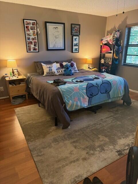 132 South Cypress Road, Unit 523 Pompano Beach, FL 33060 - Photo 11 of 25 a bedroom with bed and a couch