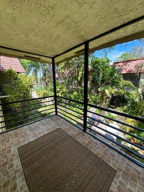 132 South Cypress Road, Unit 523 Pompano Beach, FL 33060 - Photo 18 of 25 a view of a back yard from a wooden deck