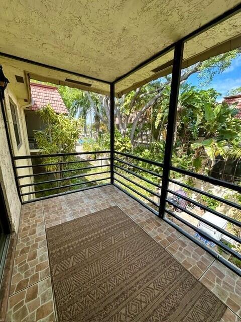 132 South Cypress Road, Unit 523 Pompano Beach, FL 33060 - Photo 20 of 25 a view of railway station with wooden floor