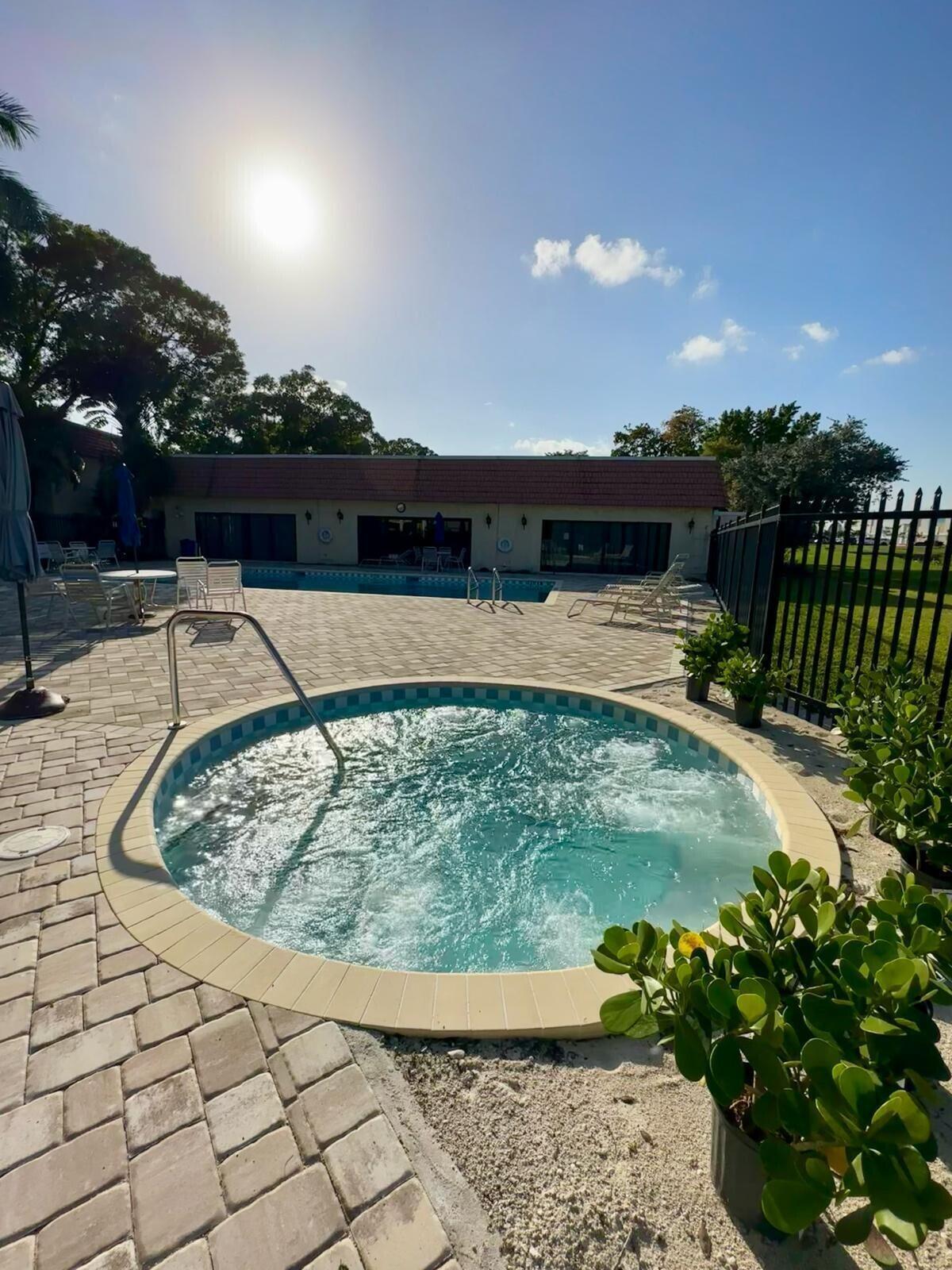 132 South Cypress Road, Unit 523 Pompano Beach, FL 33060 - Photo 24 of 25 a view of a backyard