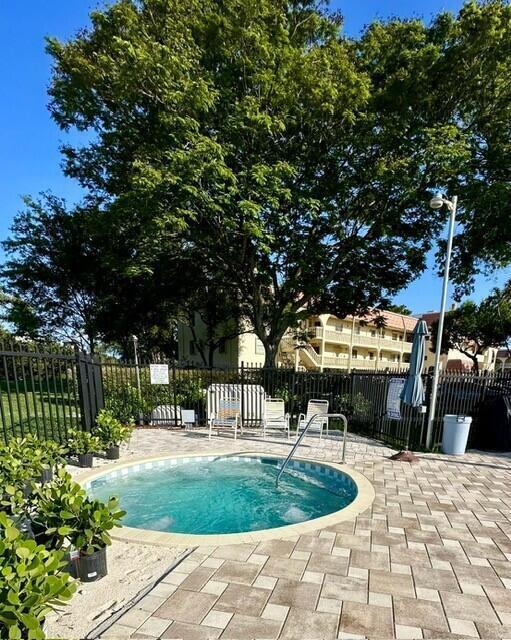 132 South Cypress Road, Unit 523 Pompano Beach, FL 33060 - Photo 25 of 25 a building view with a garden space
