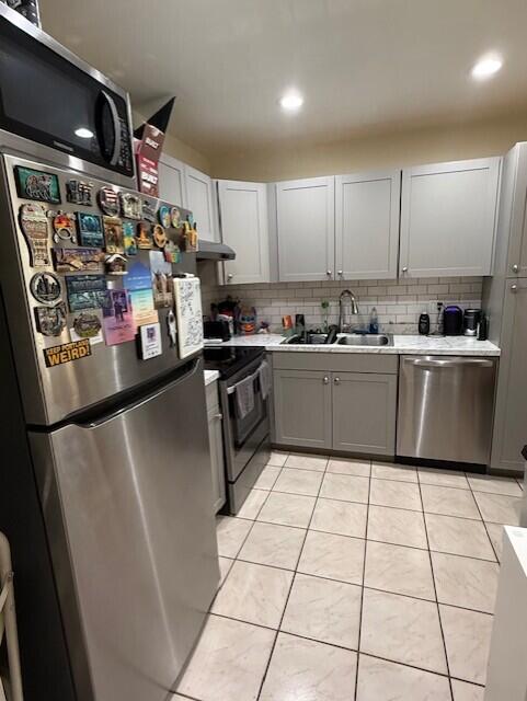 132 South Cypress Road, Unit 523 Pompano Beach, FL 33060 - Photo 6 of 25 a kitchen with stainless steel appliances a refrigerator sink and cabinets