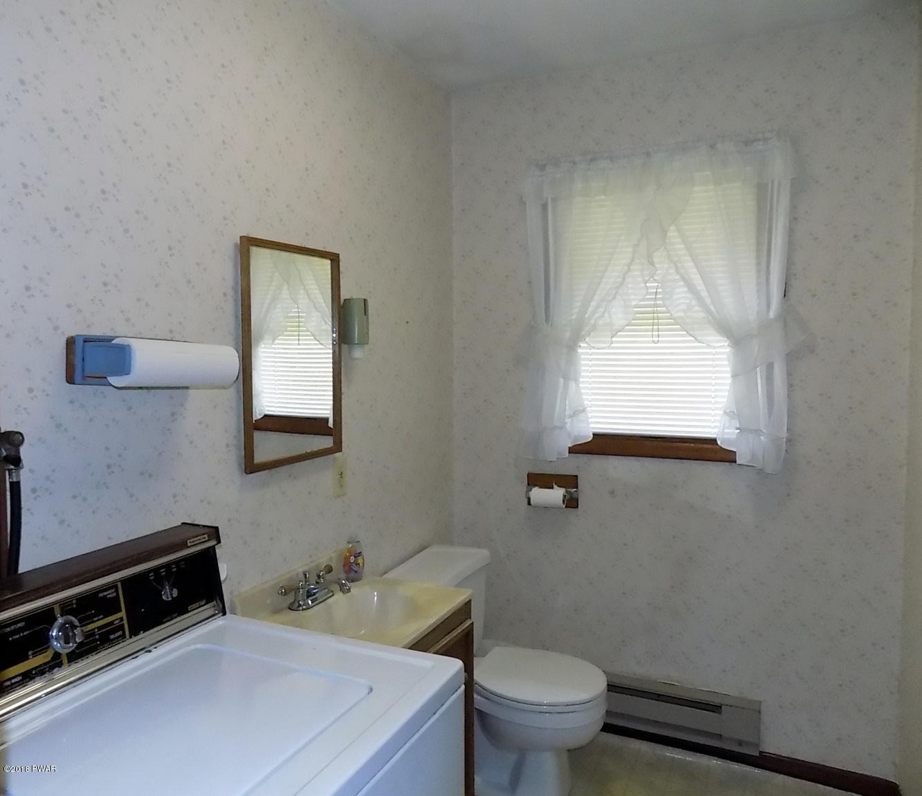 412 Ledgedale Road Lake Ariel, PA 18436 - Photo 27 of 39 1st fl 1/2 bath w/ washer
