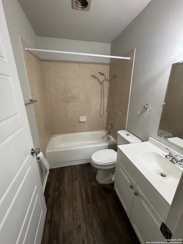 a bathroom with a sink a toilet and a bathtub