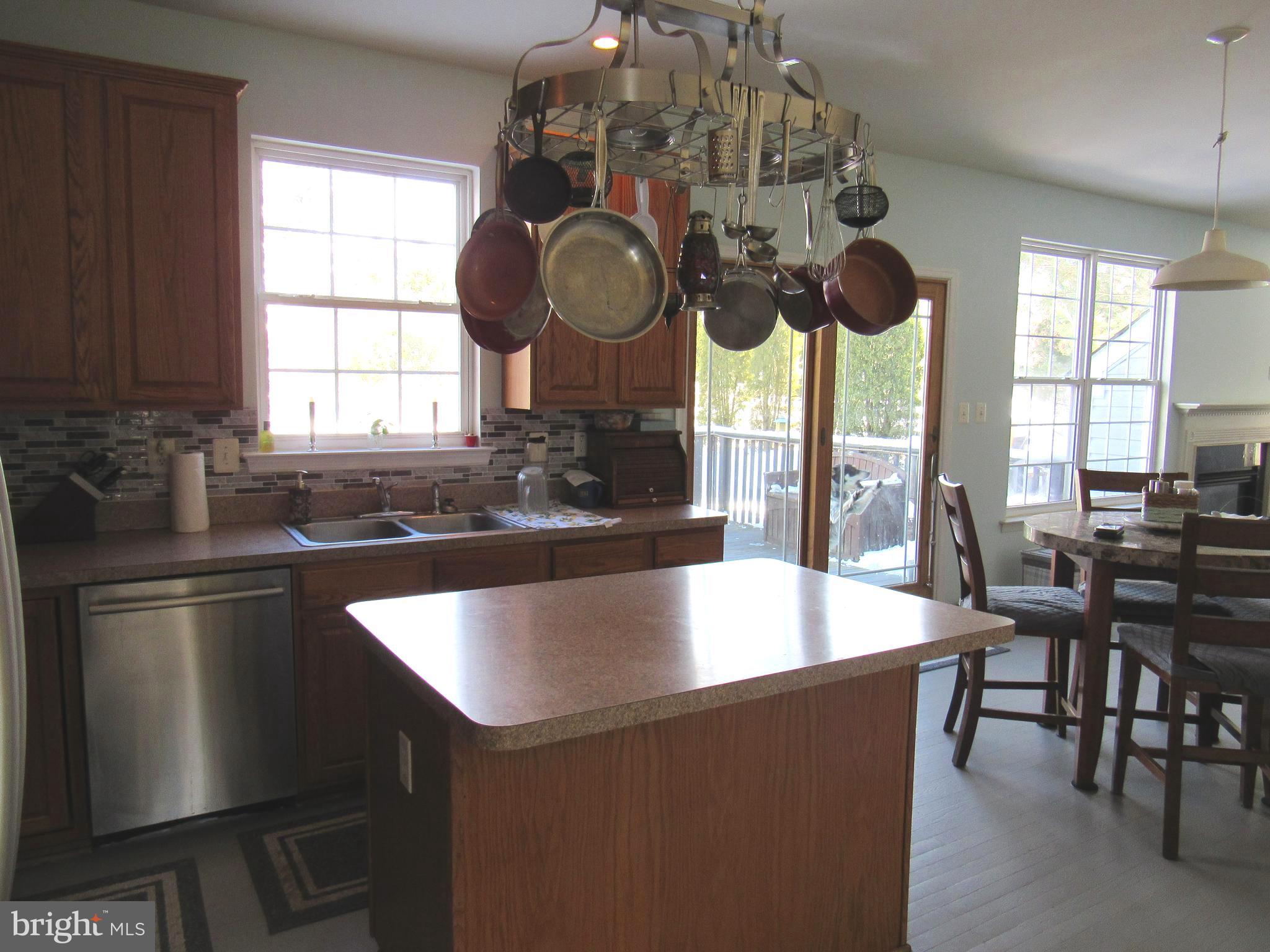 17 Wilt Road Bechtelsville, PA 19505 - Photo 13 of 31 a kitchen with stainless steel appliances granite countertop a sink a stove and a microwave