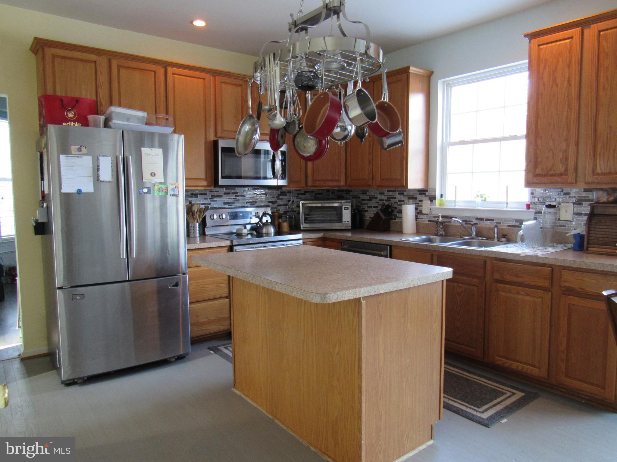 17 Wilt Road Bechtelsville, PA 19505 - Photo 14 of 31 a kitchen with stainless steel appliances a refrigerator sink and cabinets