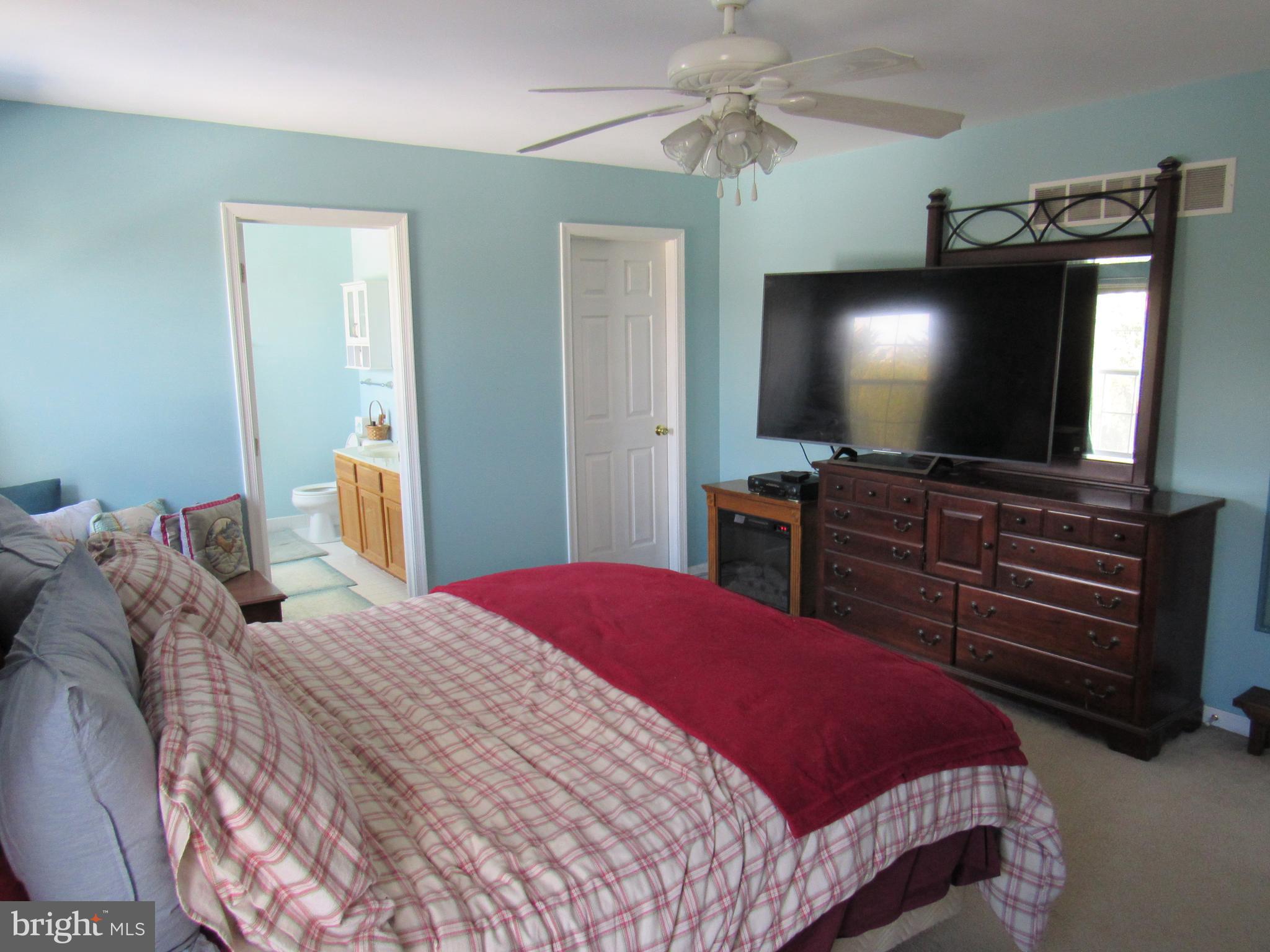 17 Wilt Road Bechtelsville, PA 19505 - Photo 21 of 31 a bedroom with a bed and a flat screen tv