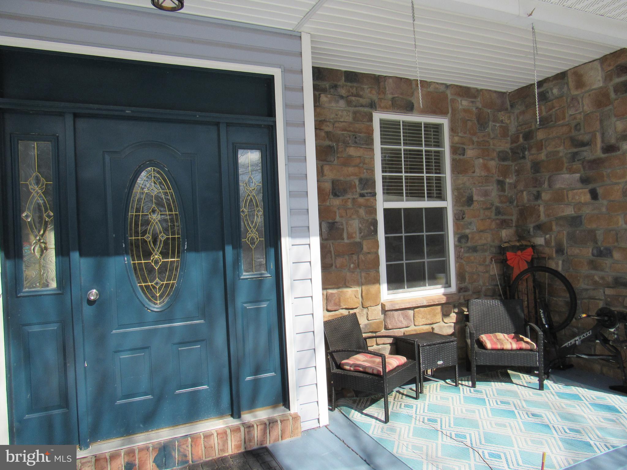 17 Wilt Road Bechtelsville, PA 19505 - Photo 4 of 31 a front view of a house with outdoor seating