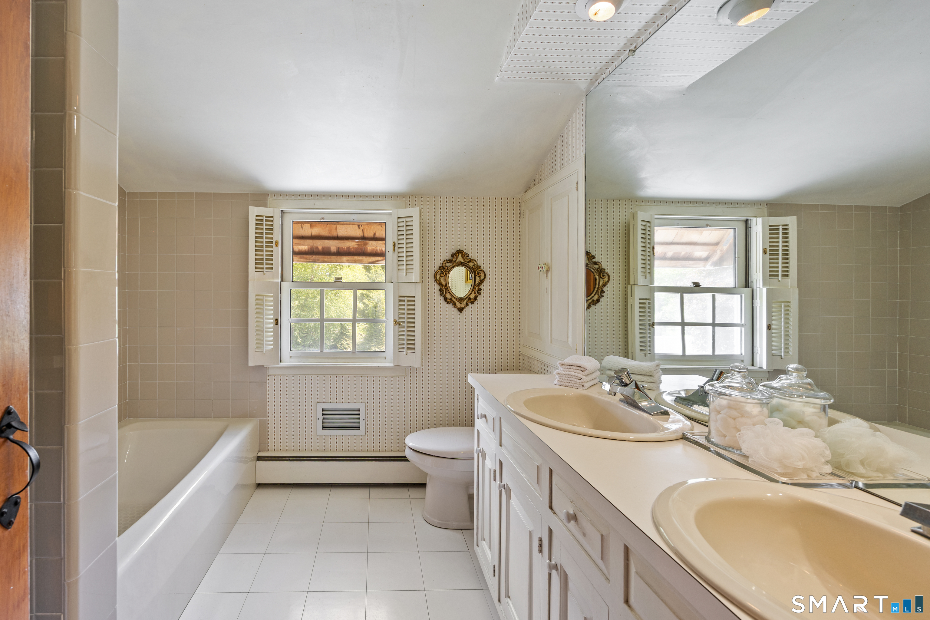 52 Susan Lane Meriden, CT 06450 - Photo 18 of 28 a bathroom with a granite countertop tub a sink and a large mirror