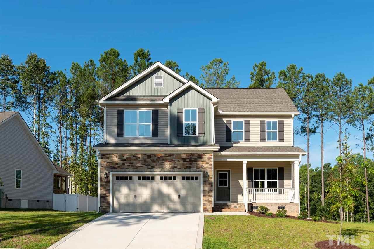 7208 Cornett Way Raleigh, NC 27604 - Photo 1 of 4 a front view of a house with a yard