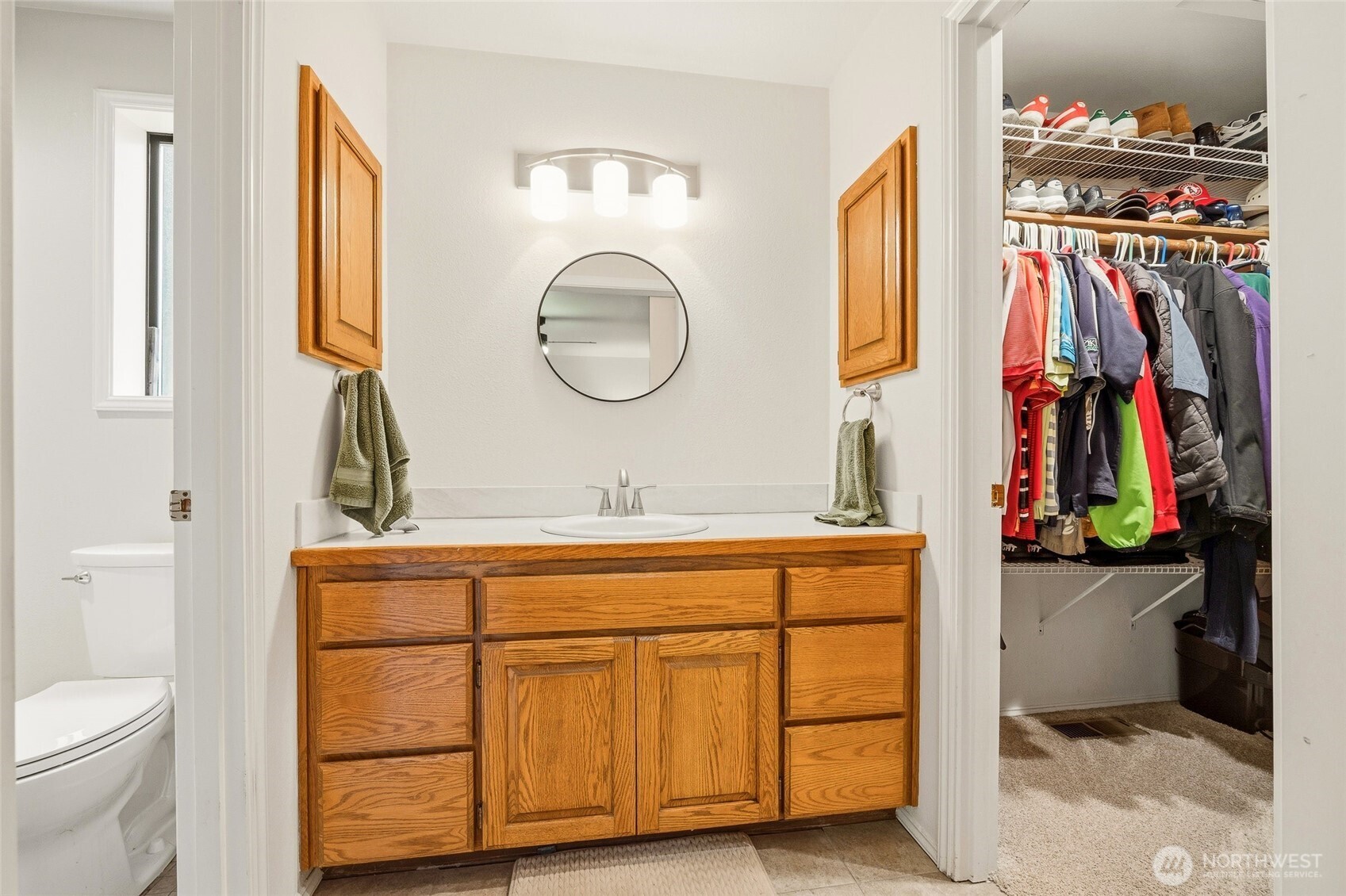 6830 Norma Beach Road Edmonds, WA 98026 - Photo 15 of 30 a view of walk in closet with clothes and shoes
