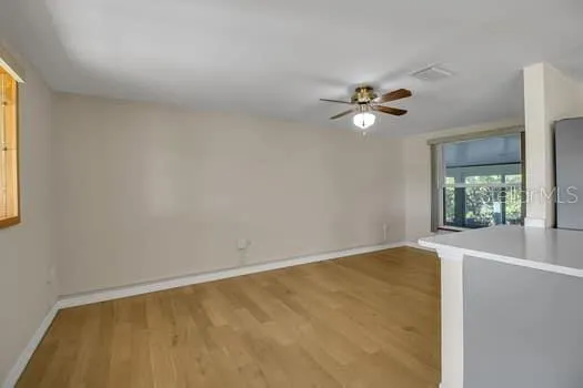 a view of an empty room with a window
