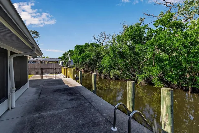 a kitchen with a sink cabinets and window