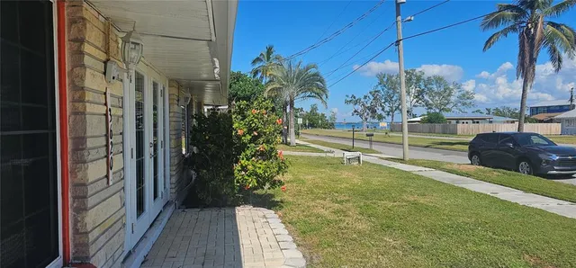 a view of a yard with an outdoor space