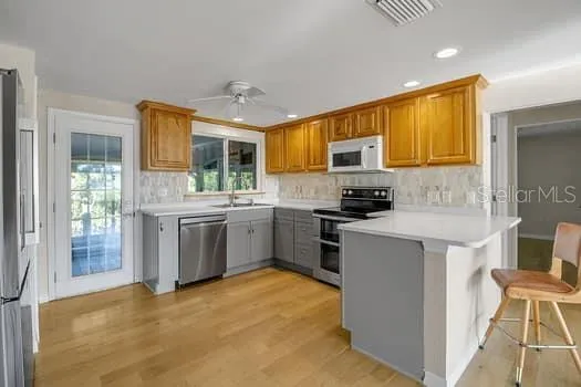 a view of a room with wooden floor and stairs