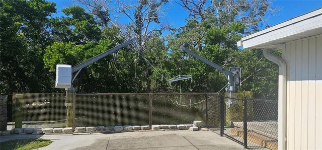 a house view with a swimming pool and garden space