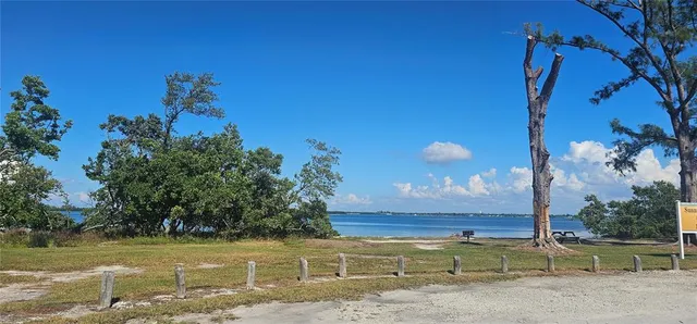 a kitchen with stainless steel appliances granite countertop a stove a sink a refrigerator and a oven