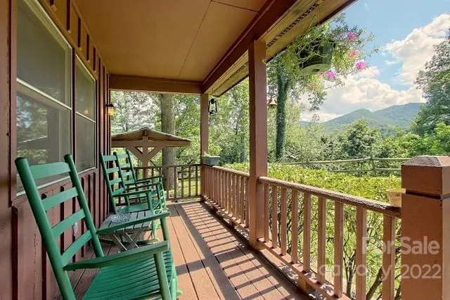 a view of balcony with furniture