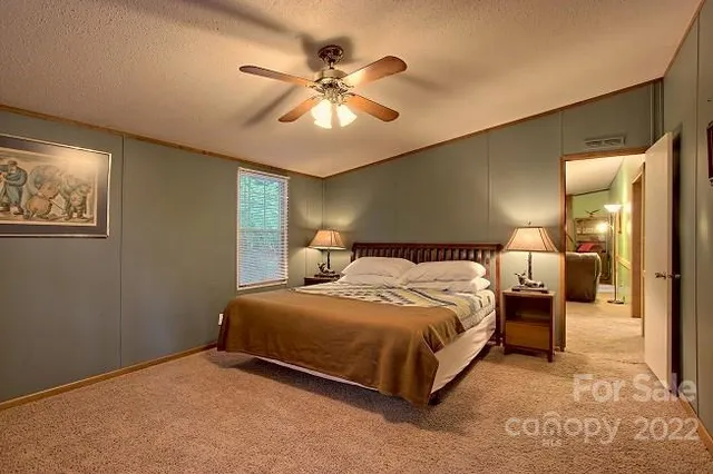 a bathroom with a sink a mirror and a shower