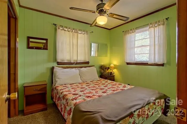 a kitchen with a refrigerator and a stove top oven