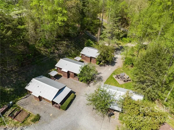 an aerial view of a house with yard swimming pool and outdoor seating