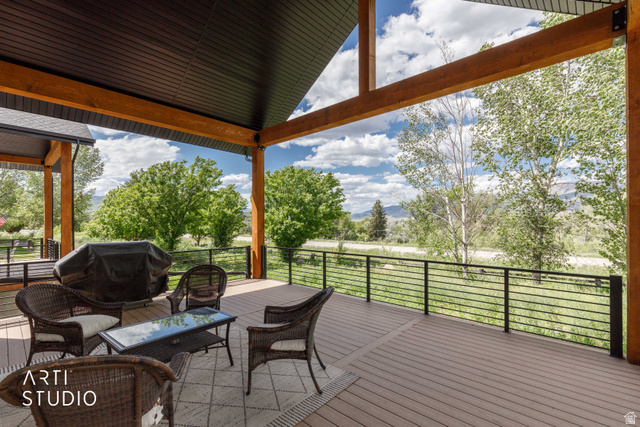 1188 South Old Trappers Loop Road Huntsville, UT 84317 - Photo 66 of 92 Expansive covered deck featuring wood-finish composite decking