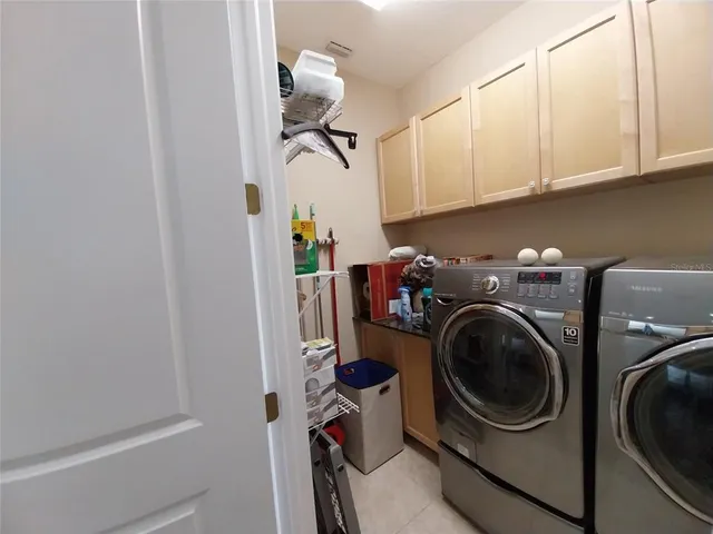 a bathroom with a granite countertop sink mirror and a bathtub