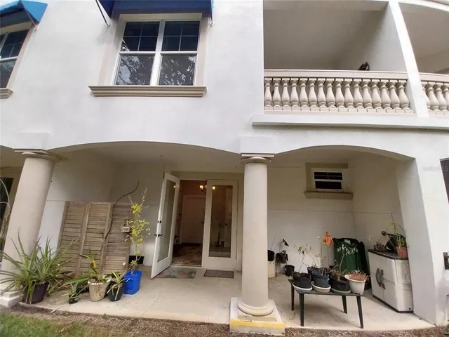 a couple of cars parked in front of brick building