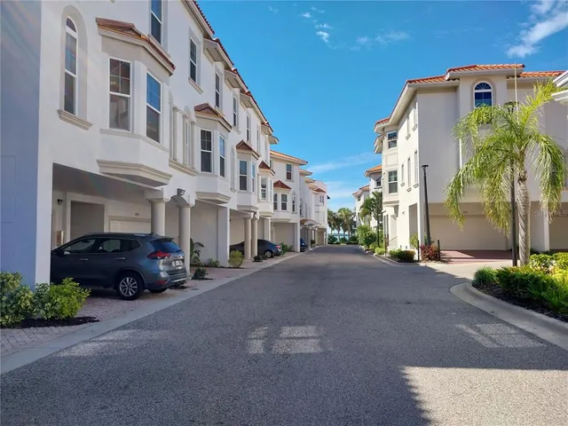 a living room with patio furniture and a fireplace