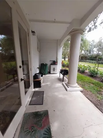 a view of a hallway with a chandelier