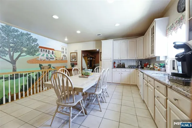 a bathroom with a sink double vanity and a toilet