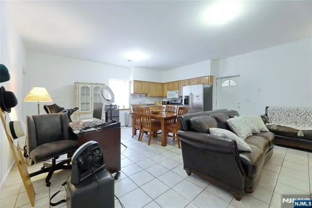 a large kitchen with a table and chairs