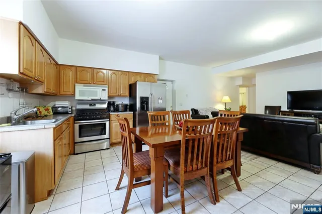 a bathroom with a sink a mirror and a shower