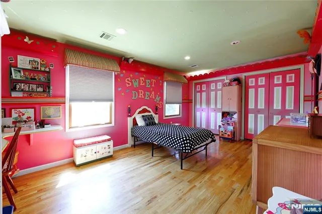 a bedroom with furniture and a window