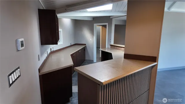 a kitchen that has a table and chairs in it